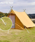 Heavy Duty 9 Inch Galvanized Steel Tent Stakes 25 Pack Rust Resistant Camping Pegs anchoring a tent on grassy terrain