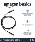 XLR Male To Female Microphone Cable For PA Systems And Recording Studios, 6 Foot Length, Black shown coiled with connectors.