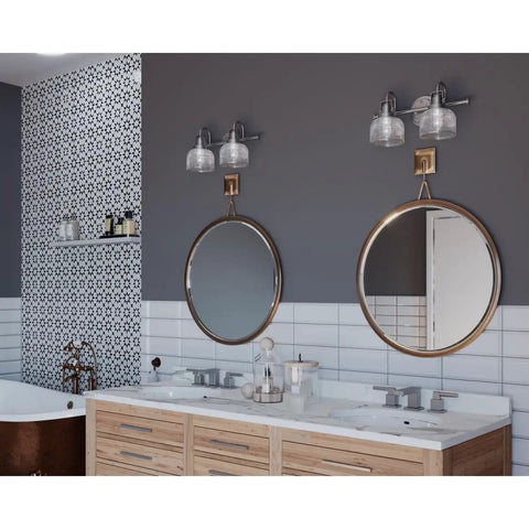 Two Light Coastal Bath Vanity Fixture With Clear Double Prismatic Glass Shades In Antique Nickel Archie Collection in bathroom setting.