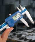 Left Handed Digital Caliper With Big LCD Screen Stainless Steel Body Dual Reading In Inches And Millimeters Ultra Accurate To 0.0015 Inches Or 0.03 Millimeters Resolution 0.0005 Inches Measures Outer Inner Depth And Step in use, showing 0.111 inches on LCD.