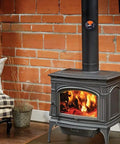 Magnetic Wood Stove Thermometer With White Needle on black stove pipe, clear display in rustic living room with brick wall.