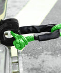 Two Pack Green Soft Shackle With 57,000 Lbs Breaking Strength Beefy Half Inch By 22 Inch Protective Sleeve attached to tow point