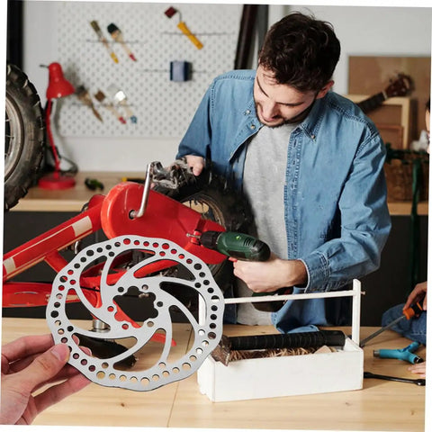 Bombproof Mechanical Disc Brake Rotor Kit For Mountain Bike Featuring Front And Rear 160 Mm Silver Rotors in a workshop setting.