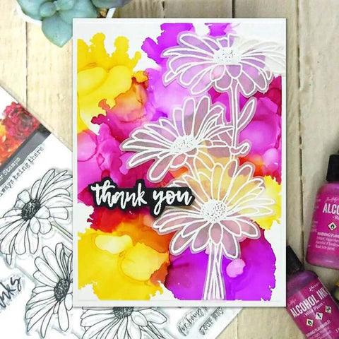 Cute Chamomile Silicone Clear Stamp and Die Set for Card Making and Scrapbooking with colorful background art.