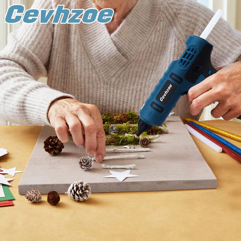 Person using Cordless Full Size Hot Glue Gun Kit With 20 Glue Sticks And Insulated Copper Nozzle 80W Anti Drip Workhorse Crafting Tool