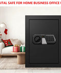 Massive Home Safe Box For Cash And Valuables With Digital Keypad, Fireproof and Waterproof Design near Christmas tree in living room