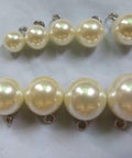 Tough As Nails Premium 304 Stainless Steel Screw Eye Hooks 5Mm By 10Mm attached to pearl beads for bracelet embellishment.