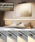 16 Inch Wall Mounted Picture Light With Slick Cct Dimming And Long Lasting Rechargeable Battery Paired With A Wireless Remote Zero Glare Flicker Free Gallery Lamp For Paintings Art Mirrors And Dartboards in a bedroom setting with adjustable brightness options.