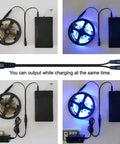 Beefy Dual Output 12V And 5V Portable Li-Ion Battery Pack With 66.6Wh powering LED strips, includes charger and cables