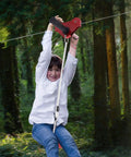 Child using Easy Backyard Zip Line Kit For Kids And Grownups, 160 Ft Of Thrill, Supports Up To 330 Lbs, Trolley With Seat