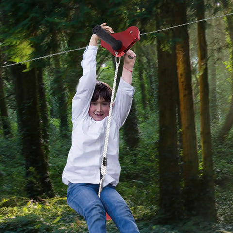 Child using Easy Backyard Zip Line Kit For Kids And Grownups, 160 Ft Of Thrill, Supports Up To 330 Lbs, Trolley With Seat