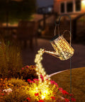 Solar Garden Lights Outdoor Hanging Lanterns With Waterproof IP65 Design illuminating garden flowers at night with copper string LEDs