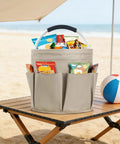 17L Foldable Cleaning Caddy with Handle and Six Pockets on beach table filled with snacks
