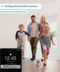 Family and dog in living room under surveillance of Plug In 3MP Indoor Security Camera With 360 Degree View, app notification shown.