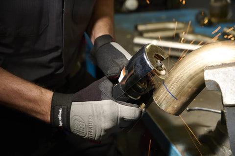Person using Air Cut Off Tool Pro Grade Heavy Duty 20000 RPM Pneumatic Type 41 on metal pipe