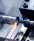 Close-up of Indexable Lathe Turning Tool Kit With 3 By 8 Inch Shank 10mm in use, cutting metal with sparks visible