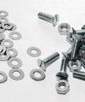 Stainless steel flat washers and screws on white surface; 5/16 in inner diameter, 11/16 in outer diameter