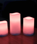 LED Flameless Candles Set Of 3 With Remote And Timer Color Changing LED Candles For Indoor And Outdoor Use glowing on table