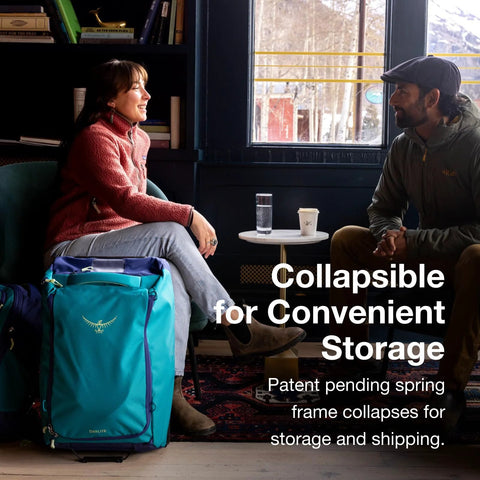 People sitting indoors with collapsible wheeled carry on duffel.