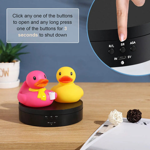 360 Rotating Display Stand Turntable Usb Powered Black Mirror Finish showcasing pink and yellow ducks on black base.