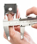 Person using Pro Grade Six Inch Stainless Steel Caliper for Inside Outside Depth and Step Measurements on metal piece