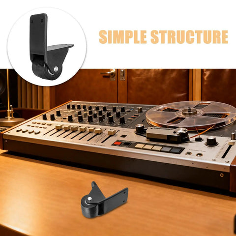 Two Pack Black Right Angle Fixed Casters With L Bracket Plates Non Swivel Rubber Wheels on a studio equipment table.