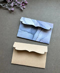 Must Have Envelope Die Set For Scrapbooking And Card Making with layered envelopes on dark background, showcasing DIY crafting potential.