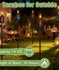 Image of 4 Pack Glass Outdoor Citronella Torches With 14 Oz Fuel, Adjustable 30 To 59 Inch Height, Multi Color Glass Flames On 4 Prong Grounded Stakes, Rust Resistant Metal, 8 To 10 Hour Burn Time, Party Ready For Patio Yard Garden Parties, lit up in a garden at night.
