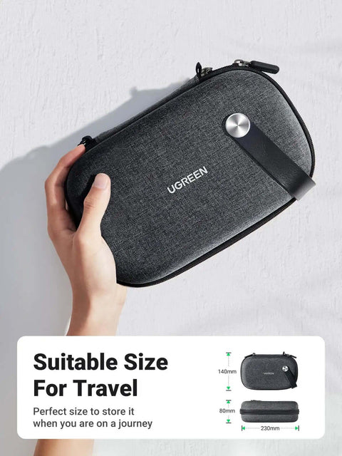 Built Like A Tank EVA Cable Organizer Travel Case Tangle Free Tech Gear Stash Pouch for Chargers, Power Banks and USB Drives held in hand.