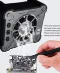 Portable Soldering Fume Extractor With 10000 RPM Brushless Motor showing smoke removal during soldering on a circuit board.