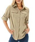Woman wearing Women's UPF 50 Long Sleeve Safari Shirt For All Day Outdoorsy Adventures With Quick Dry Moisture Wicking Tech Lightweight And Stain Resistant Fabric Great For Fishing Hiking Travel In Khaki Size M, hands in pockets.