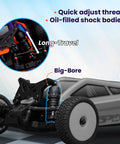 Close-up of Speck B One Twenty Four Scale 2WD Mini RC Car RTR Buggy showing oil-filled shock absorbers and quick adjust thread