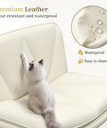 Criss Cross Legged Swivel Office Chair with wheels in beige PU leather, cat on seat, scratch resistant, waterproof texture detail.