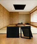 Top Tier 18x28 Inch Duct Opening Air Filter Grille And Return Vent Cover In Matte Black Steel in a modern interior setting.