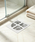 50 Pcs Disposable Shower Drain Hair Catcher 3.94" ES Square Drain installed in a bathroom shower stall with towels.
