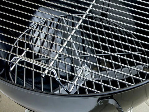 Close-up of the cooking grate on the Original Kettle Charcoal Grill 22-Inch Black with One-Touch Cleaning System and control dampers.