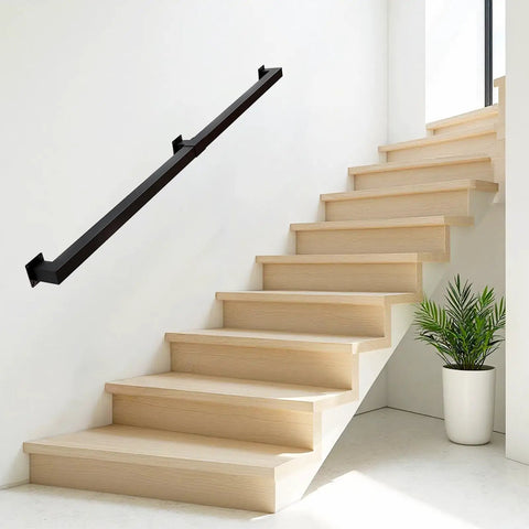 Kickass 7 Ft Indoor Stair Railing Featuring Matte Black Square Tube Handrail With Boss Level Non Slip Grip For Wall Mount Setup Totally Secure For Bathrooms Lofts And Kitchen Steps Rock Solid 500 Lb Rating mounted on a wall beside wooden stairs.