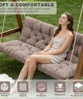 Woman sitting on Waterproof Outdoor Swing Cushions For 3 Seater With Backrest, Thickened Bench Cushions in khaki, 60x40 inches, in garden setting.