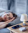Sleeping woman next to a lamp and 2-Pack 6-In-1 USB Power Strip With 3 Outlets And 3 USB Ports, Type-C Fast Charge 5V/3.4A And USB-A 5V/2.4A.