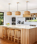 Score Some Major Farmhouse Vibes With This Hand-Woven Rattan Pendant Light Featuring A Fresh 12 Inch Wicker Shade Perfect For Killing It On Your Kitchen Island With Top Shelf Lighting Style, hanging above a kitchen island.