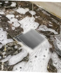 Heavy Duty Stainless Steel Shower Floor Drain Filter Top Shelf Hair Catcher Strainer in bubbly water, fitted in bathtub.