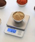 Compact High Precision Kitchen Scale For Baking And Herbs with stainless steel plate and LCD backlit display, weighing bowl of spice.
