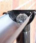 Installed Four Pack Expandable Aluminum Gutter Downspout Guards and Leaf Filter Strainers for Debris Blockage Prevention and Rodent Shield