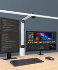 LED Desk Lamp With Clamp And Swing Arm, 31.5 Inch Wide Architect Style Desk Light over work setup with dual monitors