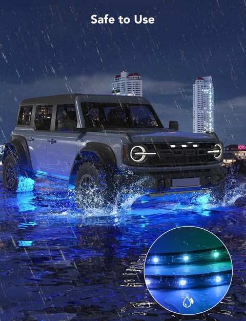 Car with glowing blue underglow lights in rain, showcasing Car Underglow Lights RGBIC Kit With 16 Million Colors And 45 Scene Modes