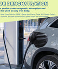 Universal EV Charger Port Cover With Heavy Duty Magnetic Seal Straight Up Waterproof Rain Snow Dust Proof Electric Vehicle Charging Plug Protector in use on a grey EV at a charging station.