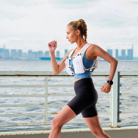 Runner wearing Lightweight Hydration Vest With 350 ML TPU Soft Bottle For Running Hiking And Cycling Adjustable Hands Free Water Pack