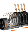Zero Hassle Expandable Pot And Pan Lid Organizer Rack For Kitchen Cabinets With Ten Snap Tight Dividers To Store Skillets Cutting Boards And Heavy Cookware Clean, displaying skillets and lids in a horizontal rack.
