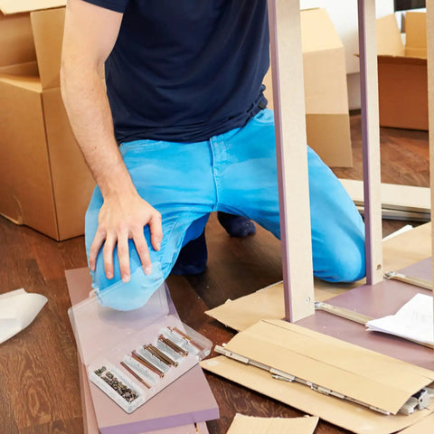 Person assembling furniture using 49 Piece M6 Hex Drive Socket Cap Screws And Barrel Nuts Set For Bed Frames And Pet Gates Replacement Furniture Bolts 40 To 80mm Compact Box Easy Install Heavy Duty Hardware Fasteners For DIY Projects.