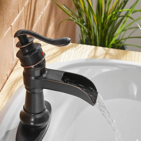 Oil Rubbed Bronze Waterfall Bathroom Sink Faucet With Single Handle 1 Hole Mount in use with clear water stream.